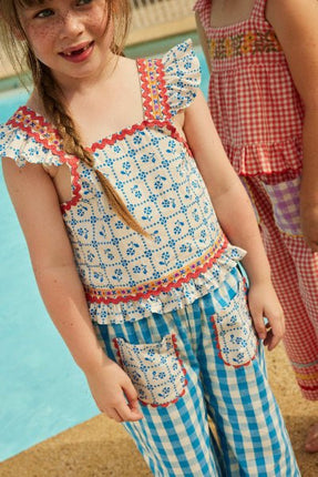 Sleeveless blouse with floral pattern