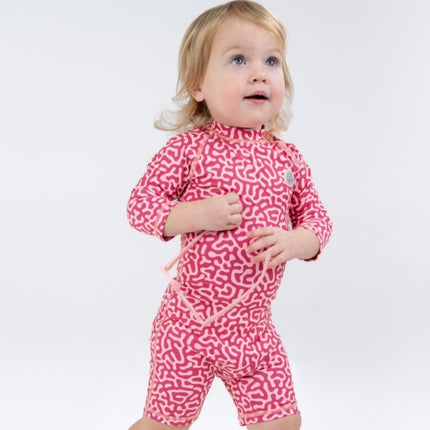a girl wearing the baby swimsuit coral reef