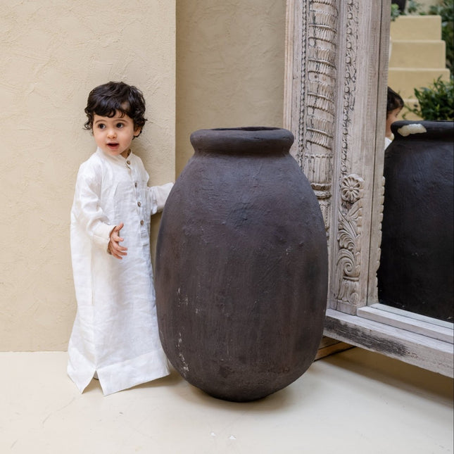 child in white thobe