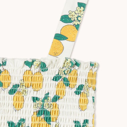 Off-white top with oranges print