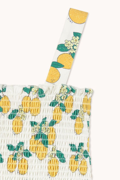 Off-white top with oranges print