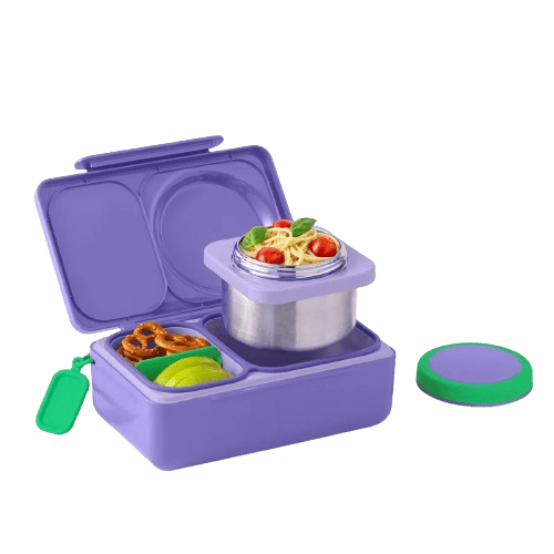 A purple plastic lunch box with compartments, shown open with a stainless steel container on top, a small green tag