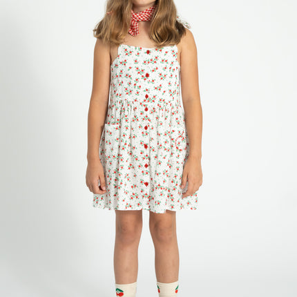 kid wearing ecru socks with cherry print on top