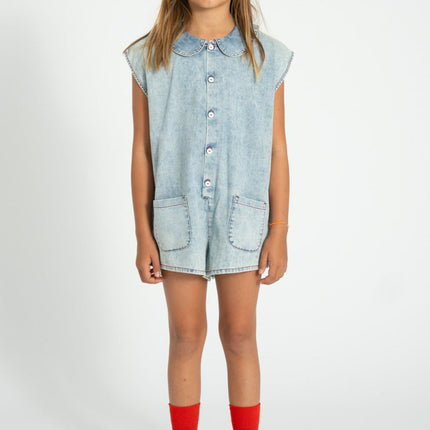 girl wearing light blue denim jumpsuit 