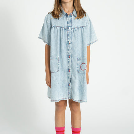 kid wearing pink socks with red stripes