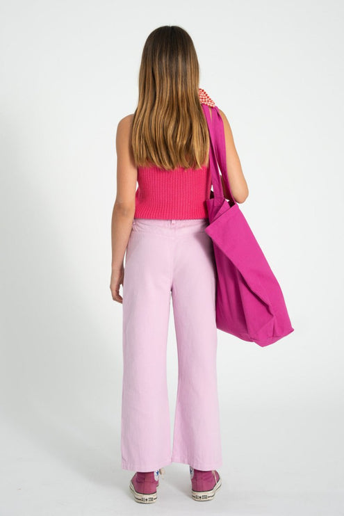 girl wearing a pink top paired with lilac pants