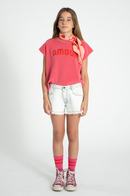 kid wearing pink sleeveless top with amour text print