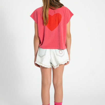 kid wearing pink sleeveless top with red heart shape print at the back