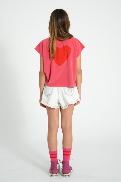 kid wearing pink sleeveless top with red heart shape print at the back