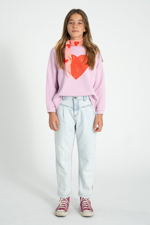 girl wearing lilac sweatshirt with heart printed 