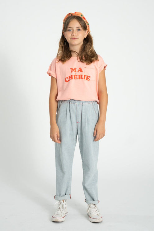 girl wearing pink tshirt with chest pocket 