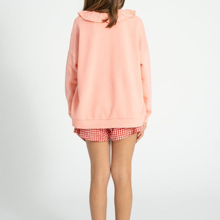 girl wearing pink sweatshirt 