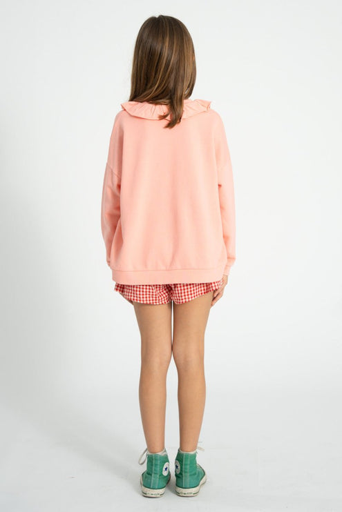girl wearing pink sweatshirt 