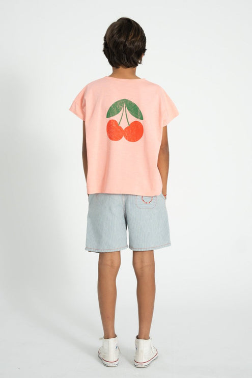 boy wearing shirt with cherry print at tthe back