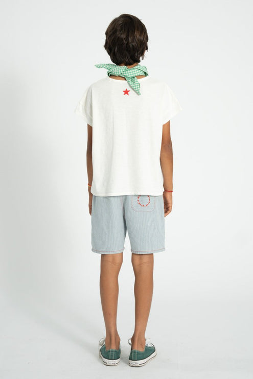 child wearing white shirt with red star on top