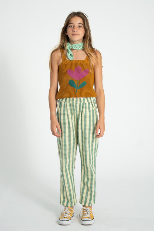girl wearing knitted top with flower detail