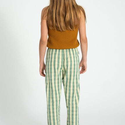 girl wearing brown knitted top