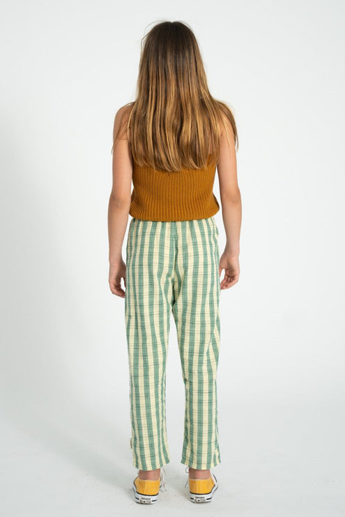 girl wearing brown knitted top