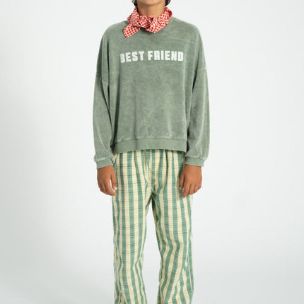 boy wearing washed greeen sweatshirt