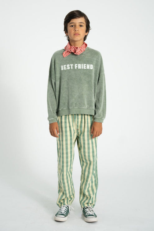 boy wearing washed greeen sweatshirt