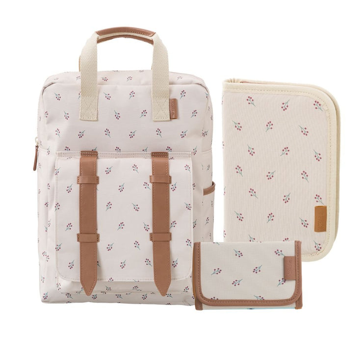 A matching three-piece set including a backpack, a diaper cover, and a small pouch, all in a cream fabric with a small pink floral print and tan faux-leather trim.