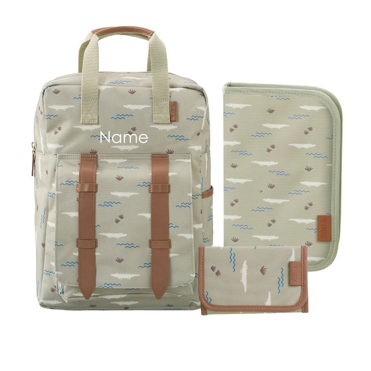 A personalized backpack set featuring a beige and light green patterned backpack with brown faux-leather straps, shown alongside matching zippered pouches on a white background.