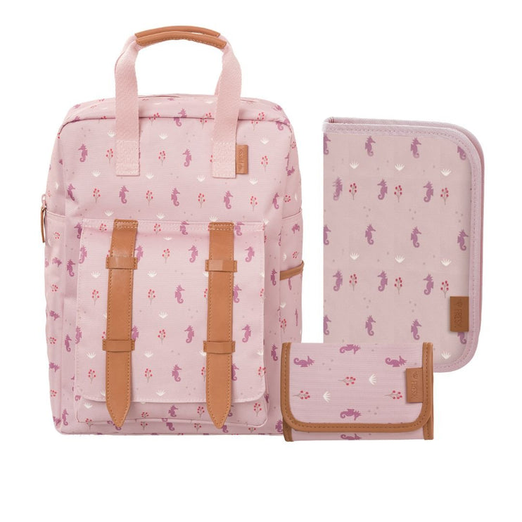 A pink patterned backpack set  including a backpack, a matching zippered pouch, and a small wallet. The backpack has tan faux-leather straps and handles, and the set features a pink and white seahorse print.