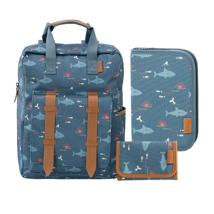 A matching three-piece school set including a backpack, a zippered sleeve, and a small pouch, all in a blue fabric with shark  print, accented with brown faux-leather trim.