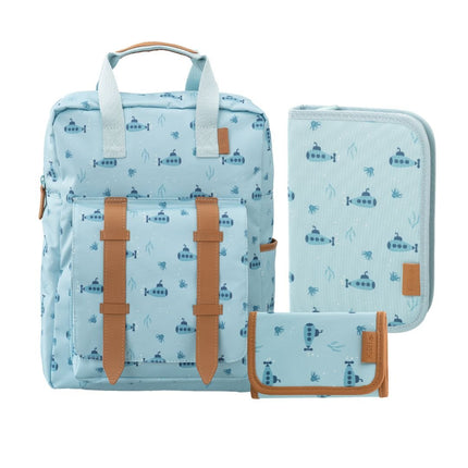 A matching three-piece school set including a backpack, a zippered pouch, and a small wallet, all in a light blue fabric with a repeating dark blue submarine pattern and tan leather accents.