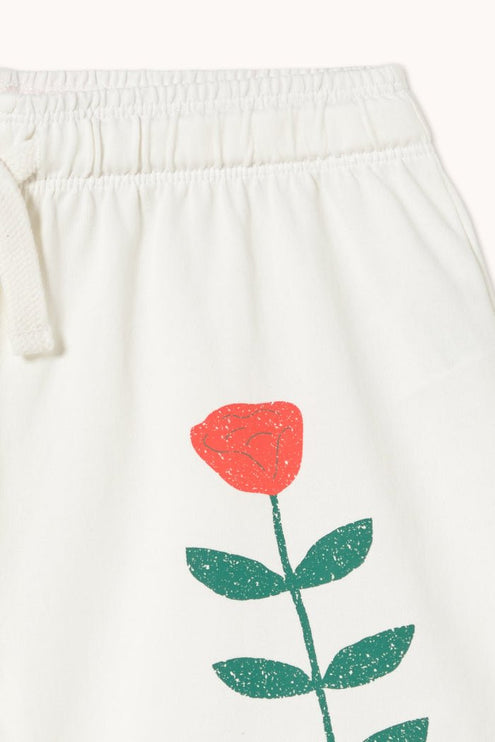 Off-white shorts with a red rose print