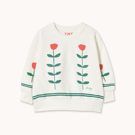 White sweater with red flower designs