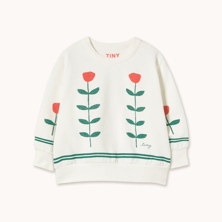White sweater with red flower designs