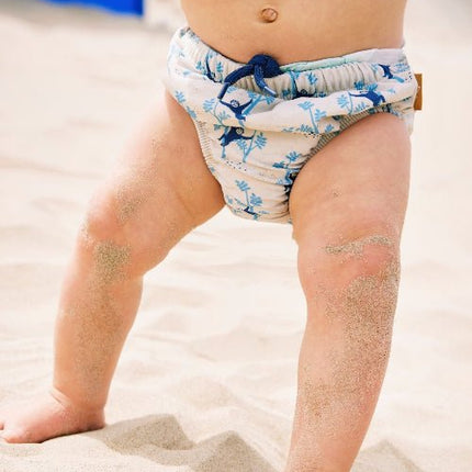 Baby boy wearing Cream with blue Monkey prints reusabe swim diaper pants