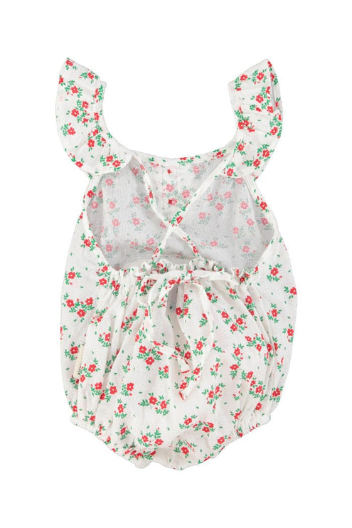 baby romper with fringe straps on a white background