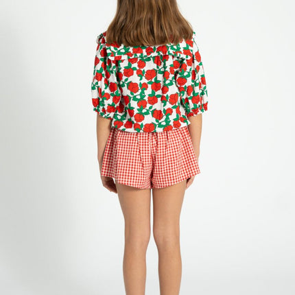 a blouse with red roses print 