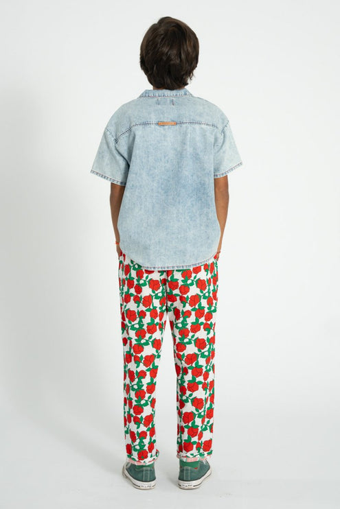 kid wearing pants with red rose pattern