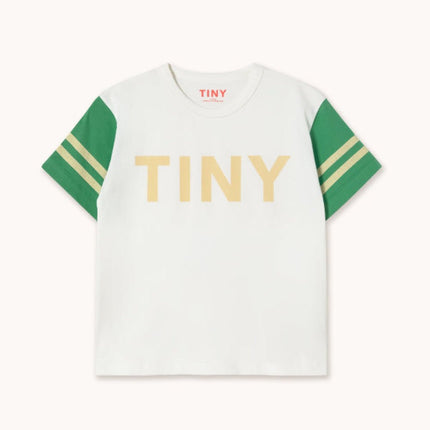 White t-shirt with green sleeves and 'TINY' printed in gold