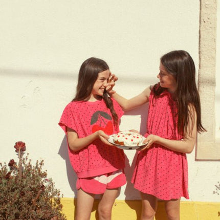 Girl wearing red socks with heart print