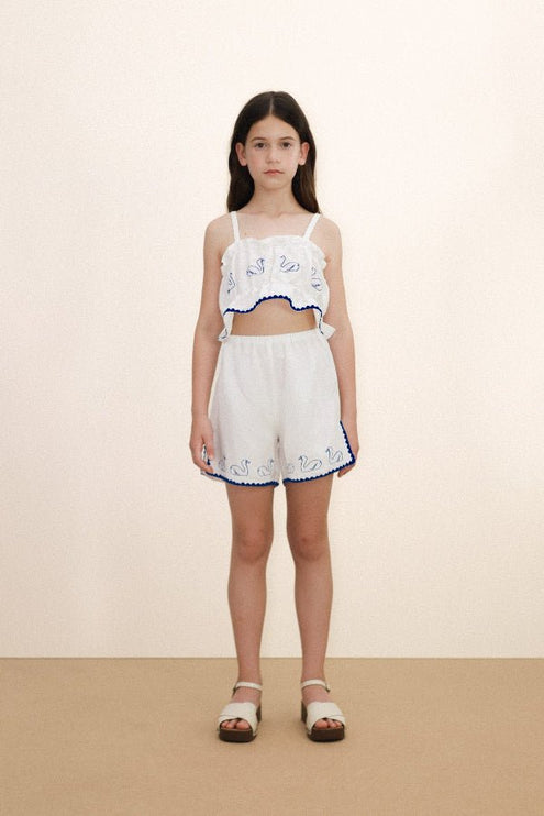 Off-white top with blue swans print