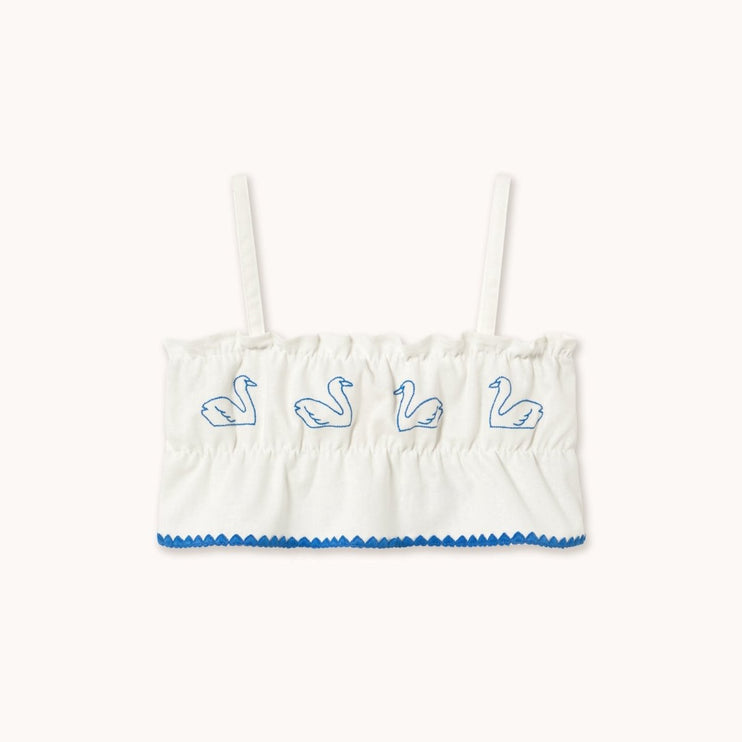 White tank top with blue trim and embroidered swan designs
