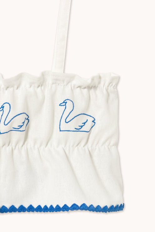 Off-white top with blue swans print