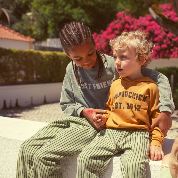 Boy wearing washed green sweatshirt with bestfriend print