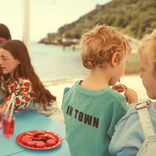 Backview Boy wearing Turquoise t-shirt with bestfriend print in front and in town print at the back