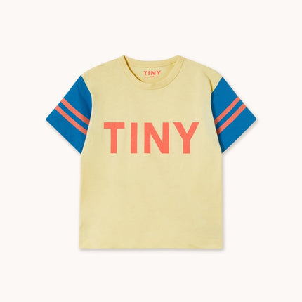Yellow t-shirt with blue sleeves and red 'TINY' text