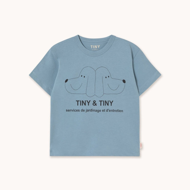 Blue t-shirt with 'Tiny & Tiny' logo and text 