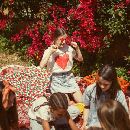 Girl wearing tshirt with collar and red heart print