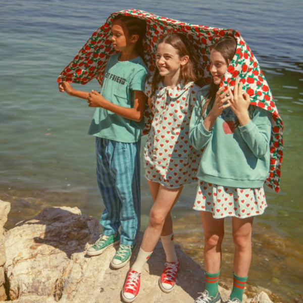 Boy wearing unisex trouser with blue and green checkered