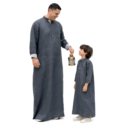 Man and child in matching long dark gray thobe