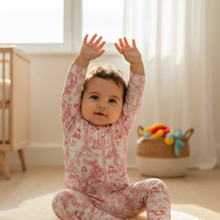 Baby in pink floral pajamas