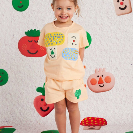 Child wearing a colorful outfit with cute design